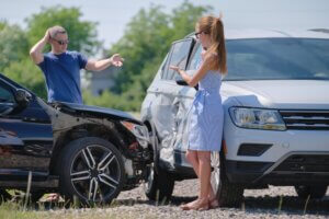 Man and Woman Arguing in a Car Accident