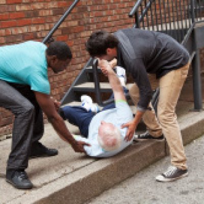 stock-photo-21383998-two-young-men-helping-fallen-down-senior-multi-ethnic Two young men helping fallen senior